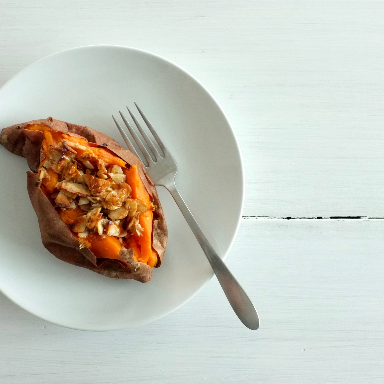 Baked Sweet Potatoes with Candied Coconut-Almond Topping
